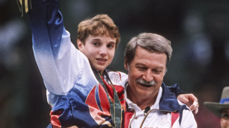 Bela Karolyi carries Kerri Strug