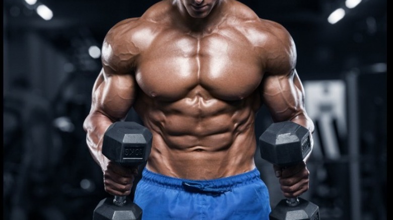 male bodybuilder with weights