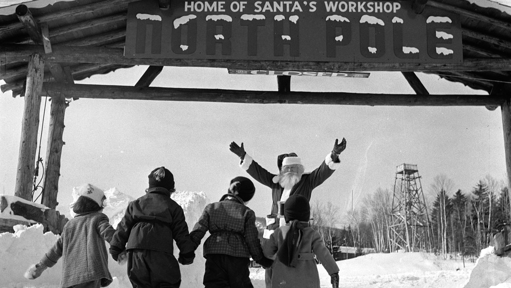 Santa welcoming visitors to North Pole, New York