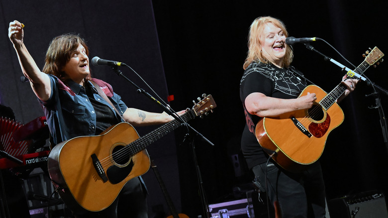 Indigo Girls on stage with acoustic guitars