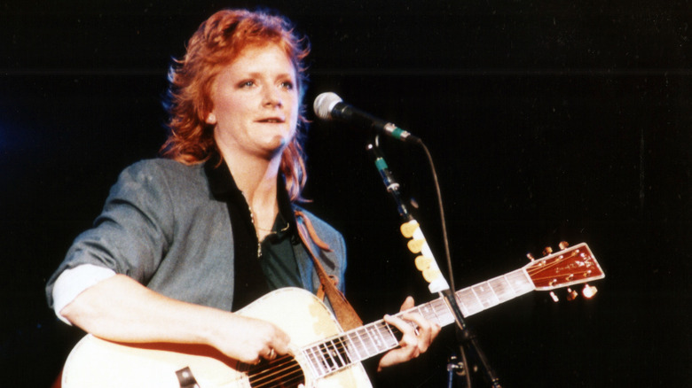 Emily Saliers on stage with guitar