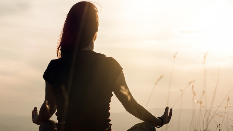 Woman seated  in yoga pose