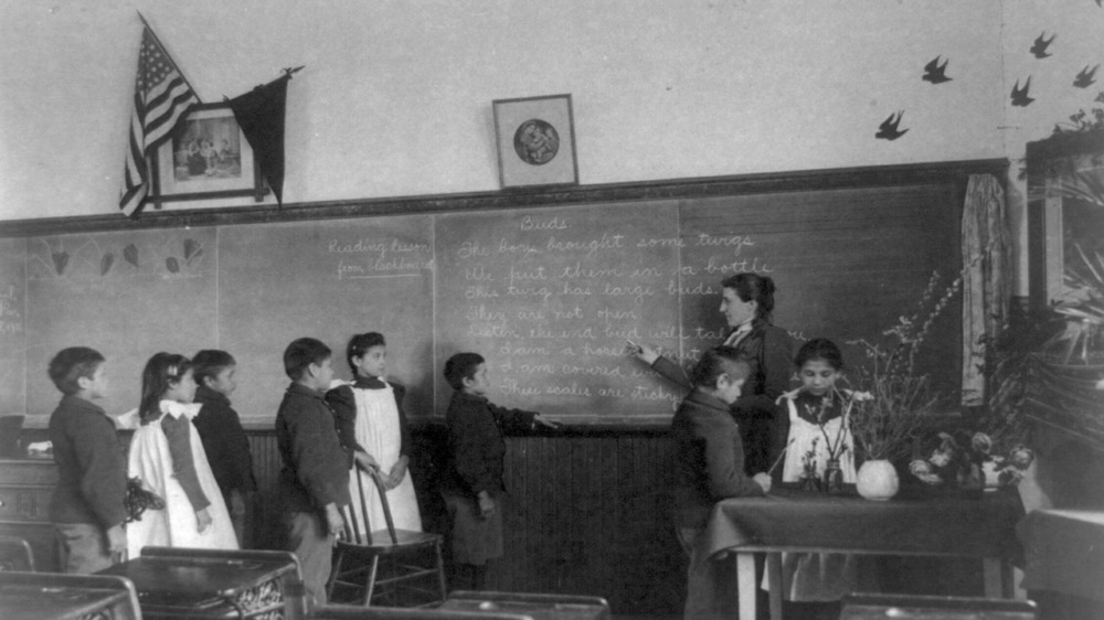 Elementary class Carlisle in front of chalkboard