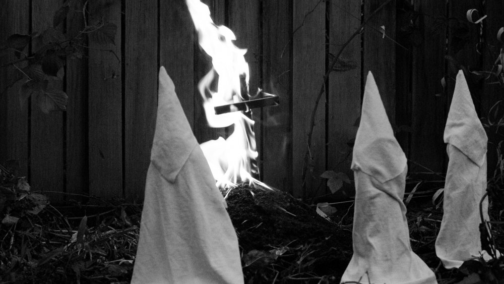 KKK around burning cross