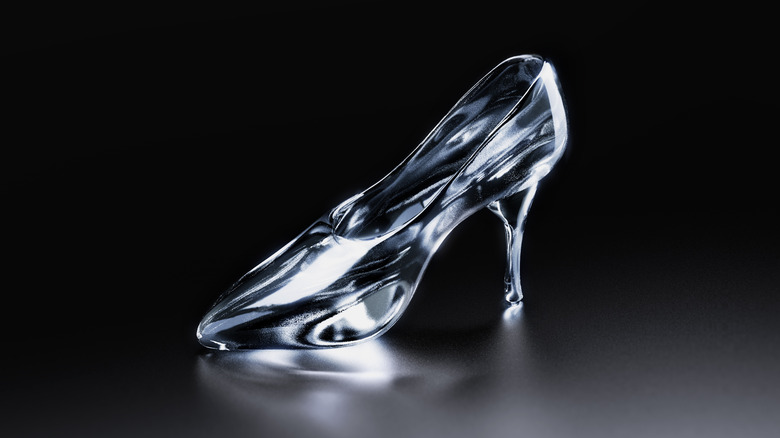 Glass slipper against black background