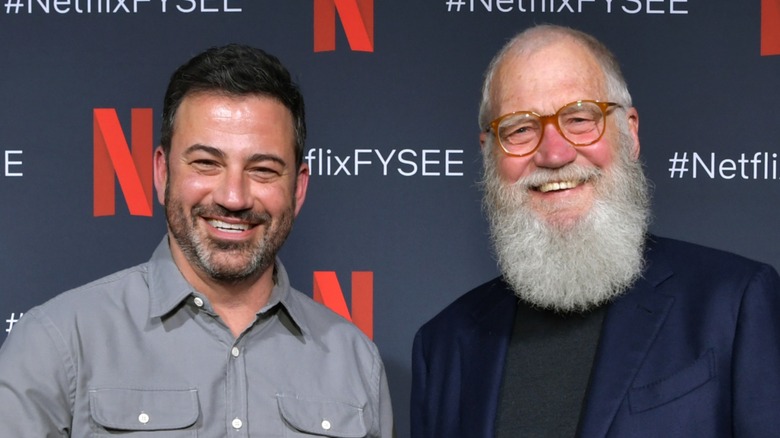 Jimmy Kimmel and David Letterman smiling and shaking hands at Netflix event