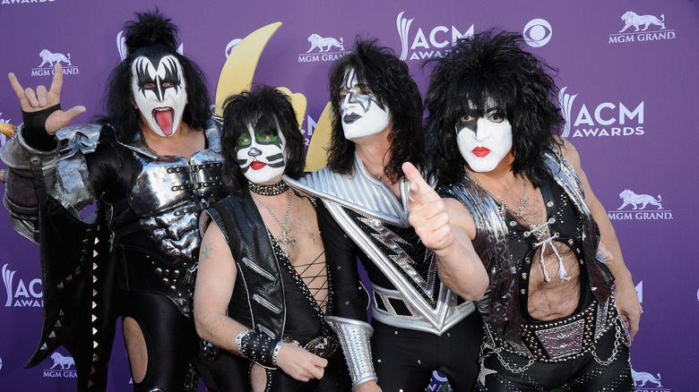 The rock band Kiss posing for a photo at the Country Music Awards in 2012