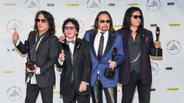 Paul Stanley, Peter Criss, Ace Frehley and Gene Simmons posing for a photo at the Rock and Roll Hall of Fame 2014