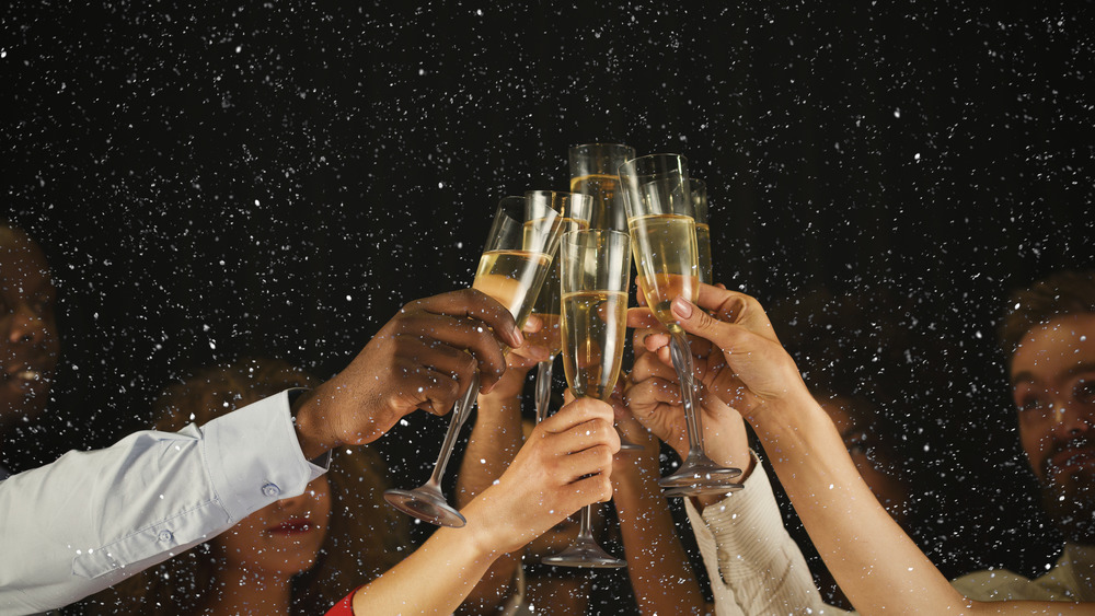 Young people toasting with champagne