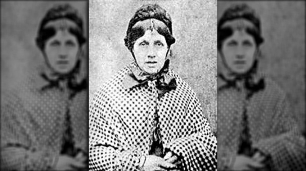 Mary Ann Cotton wearing checked shawl