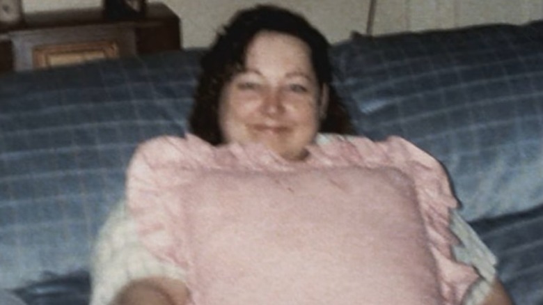Kathy Loreno smiling with pillow
