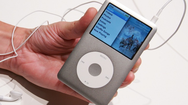 A hand holding an iPod classic