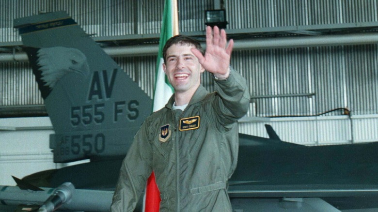 Scott O'Grady in uniform smiling waving