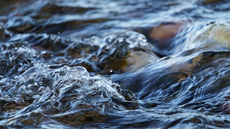 river water flows over rocks