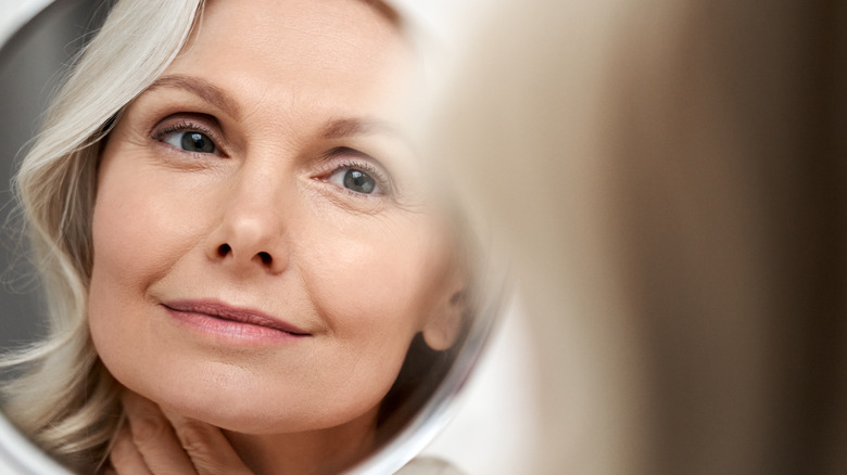 woman looking in a mirror