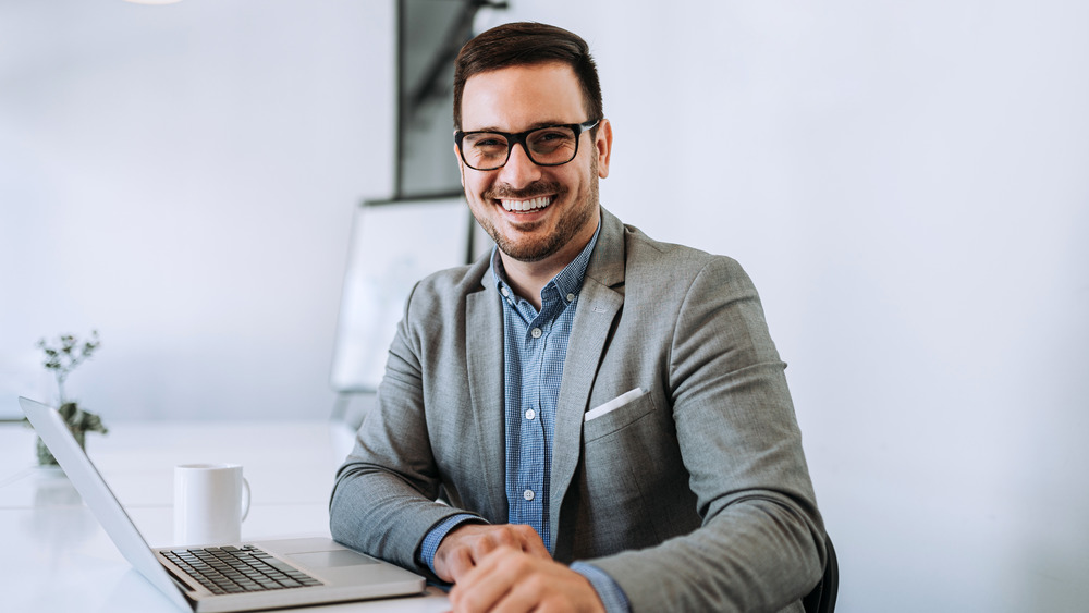 Smile white guy in an office