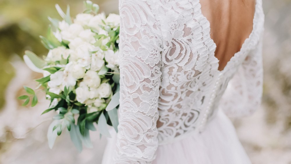 back view of bride with bouquet