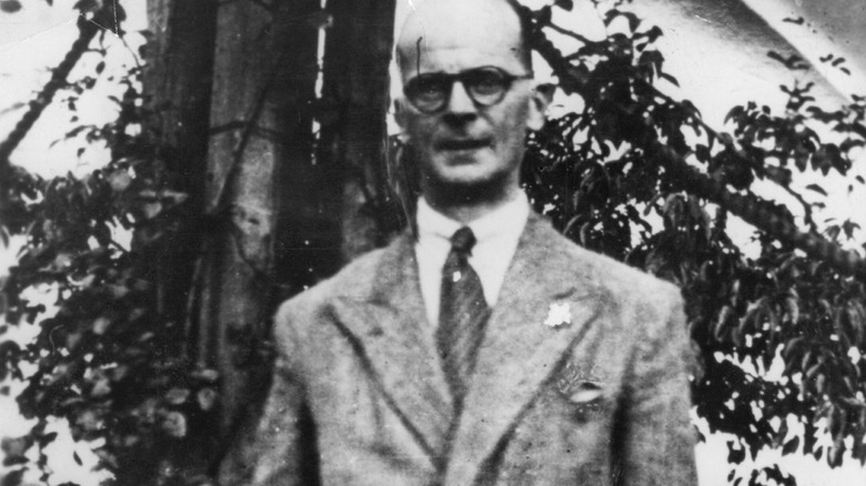 John Christie wearing a suit