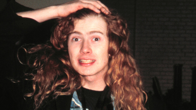 young Dave Mustaine with hand on head