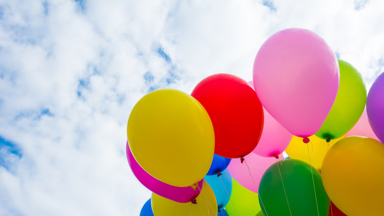 Balloon bouquet floating in sky