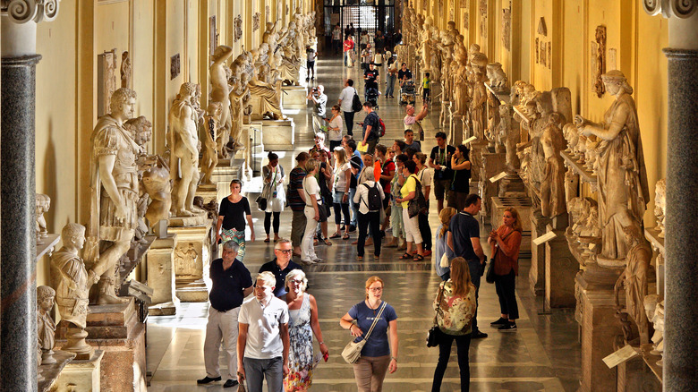 Visitors walk in Museo Chiaramonti 