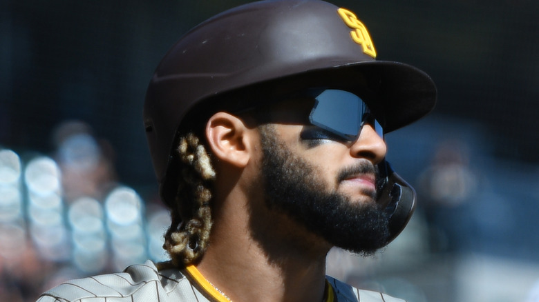 Fernando Tatis Jr. wearing helmet sunglasses