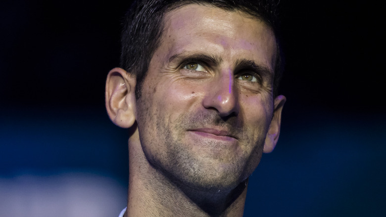 Novak Djokovic smirking