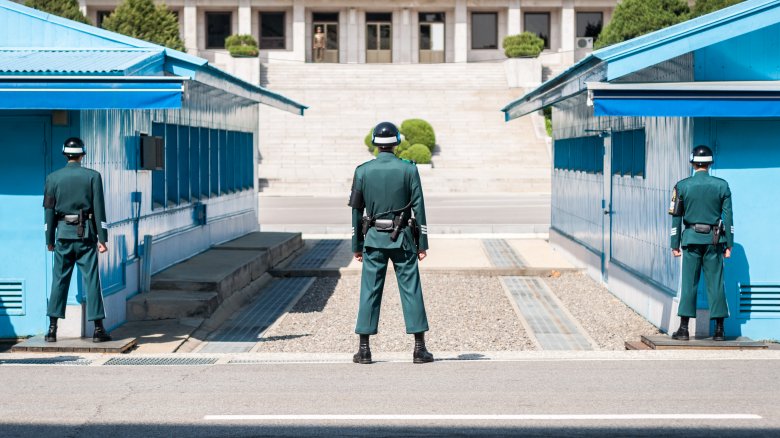 Korean DMZ men standing