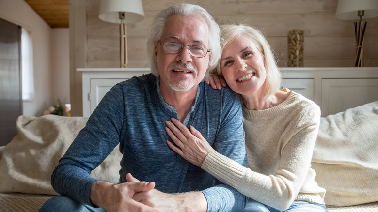 Grandparents smiling at camera