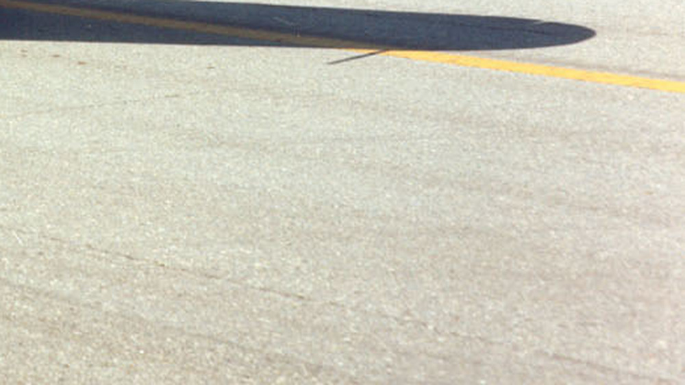 shadow of the wing of a plane