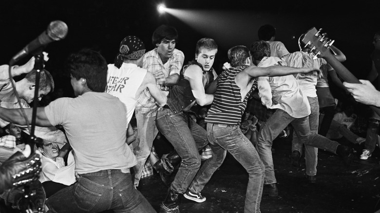 fear plays while a riot breaks out on stage in the early '80s