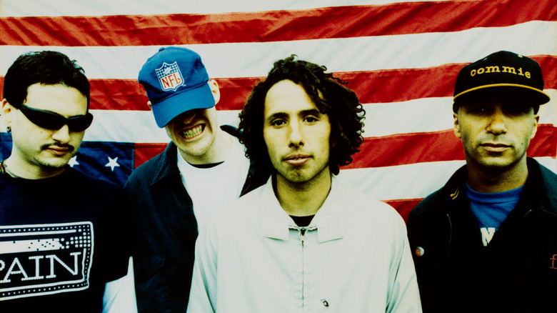 rage against the machine standing in front of U.S. flag in 1996