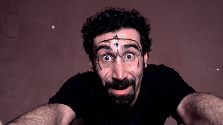 serj tankian of system of a down in photoshoot bugging out eyes