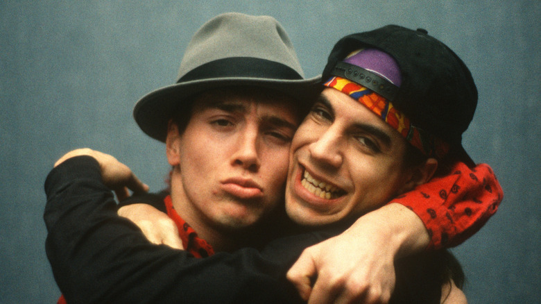 john frusciante and anthony kiedis of the red hot chili peppers hug in 1992