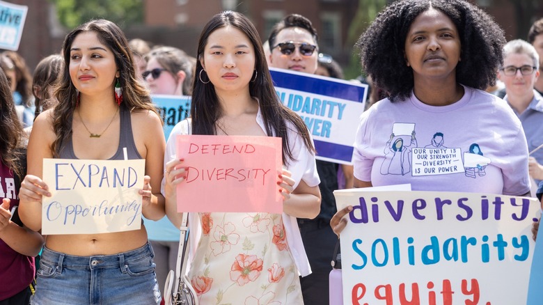 Students holding pro-Affirmative Action signs