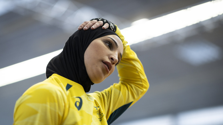 Tina Rahim trains yellow shirt