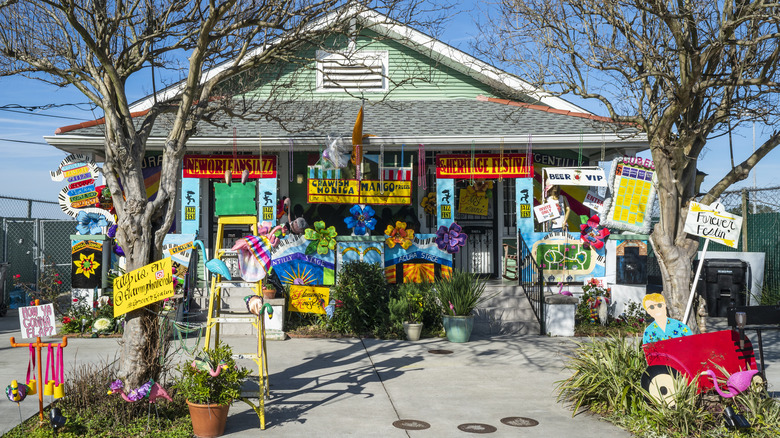 colorful signs in front of house