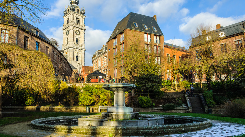 building in mons belgium with water fountain