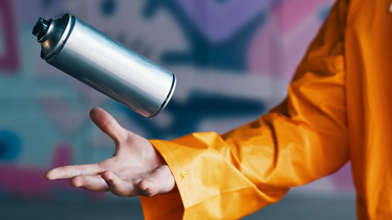 graffiti artist with spray can