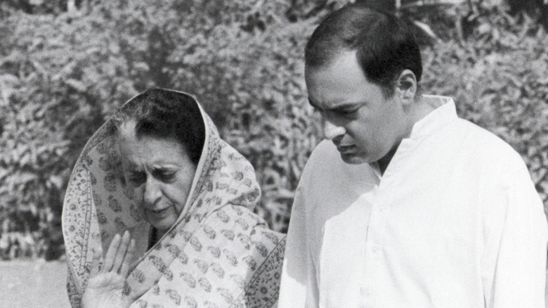 Indira and Rajiv Gandhi white clothing walking garden