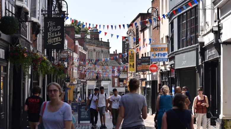 people walking through Central Derby