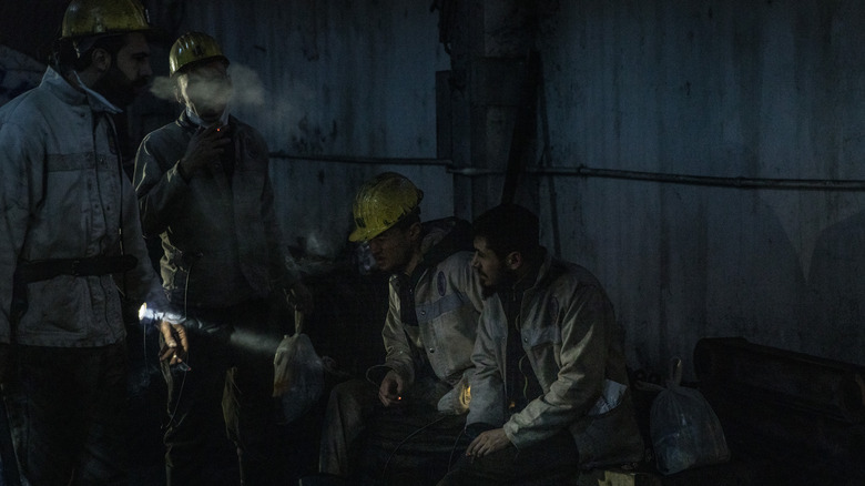 Coal miners arrive for their shift 