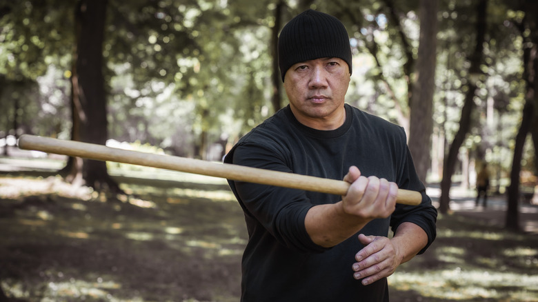 man holding stick