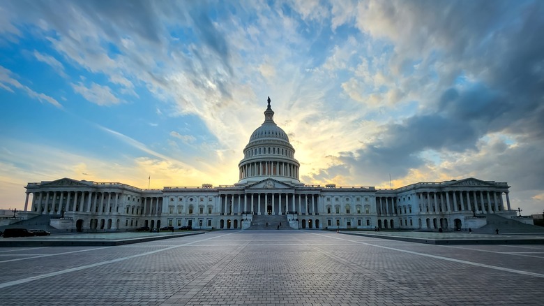 Capitol Hill under blue sky clouds