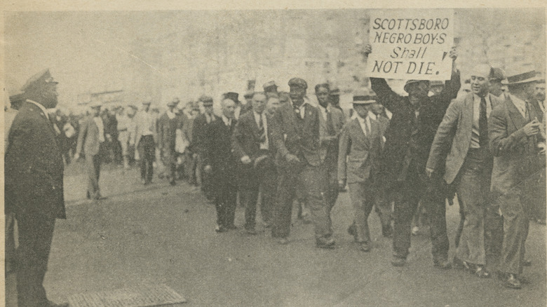 Black protestors holding sign for Scottsboro defendants