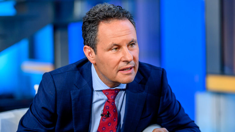 Brian Kilmeade leaning forward while speaking