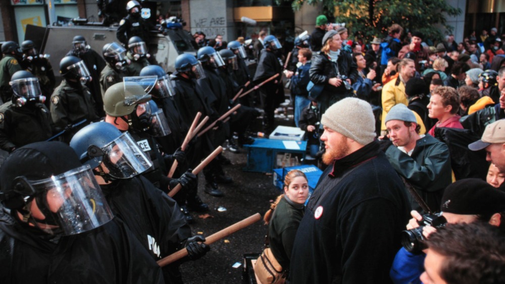 wto protesters lined up in front of police