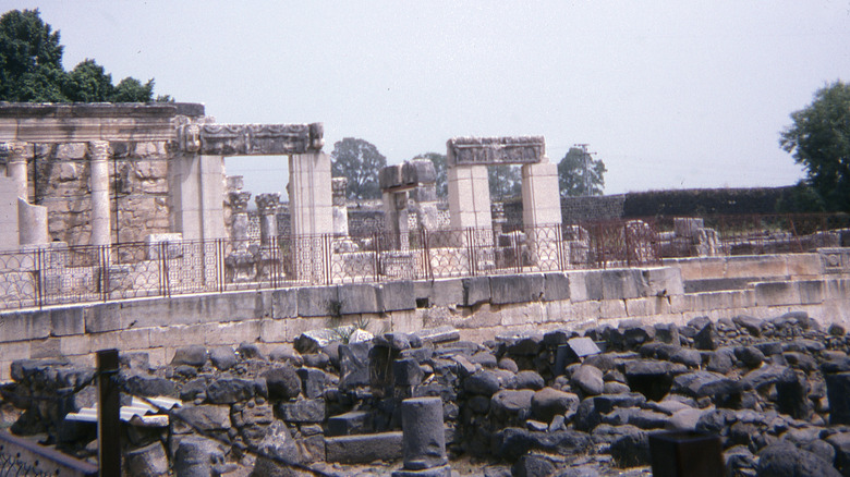 Ruins of synagogue stand behind fence