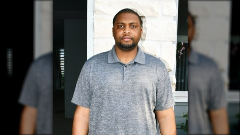 Chukwuebuka Nwobodo scowling against a wall