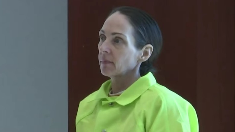 Kimberly Kessler wearing a green jumpsuit while appearing in court